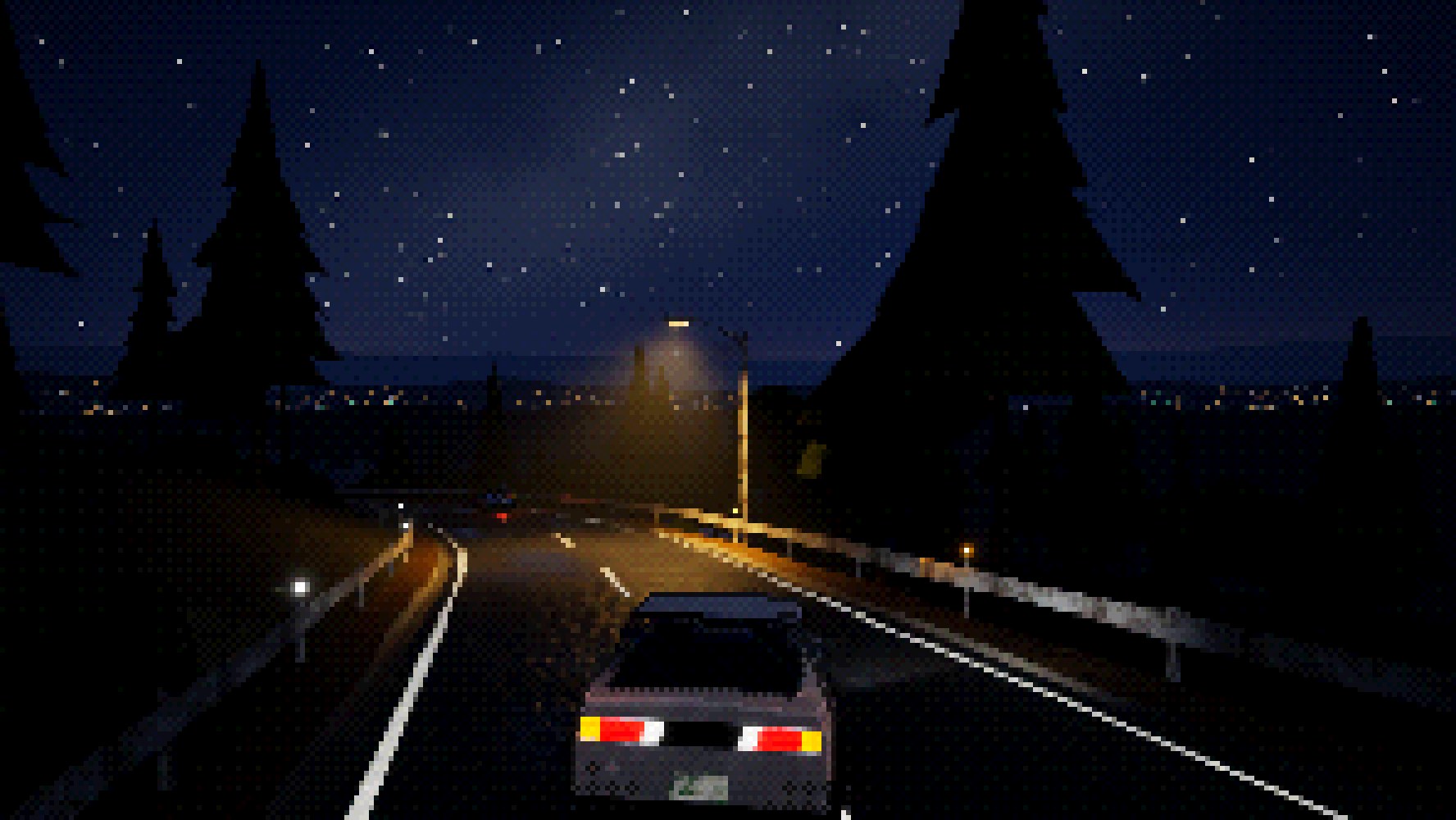 Night on Mt. Haruka: a streetlamp over the road and the lights of the valley town below